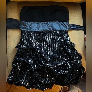 Black strapless sequin mini dress with ruffled skirt and tie waist — size 11